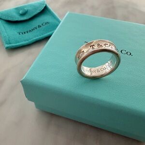 Tiffany & Co. Silver Logo Band Ring with Signature Blue Pouch